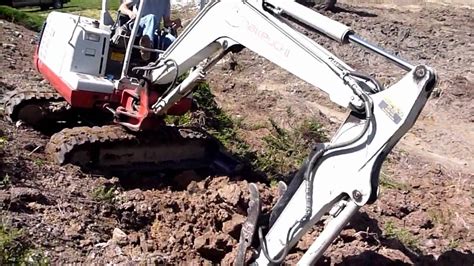 mini excavator on slope|mini ex up a slope.